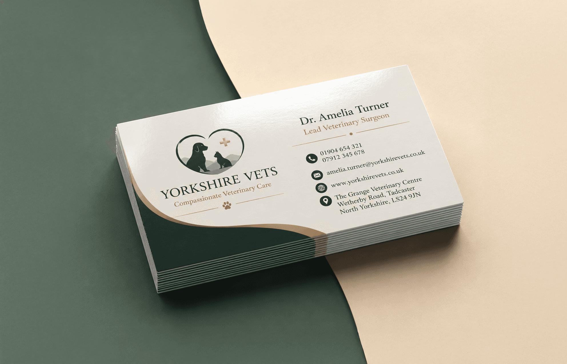 Stack of premium business cards on a green and cream studio surface